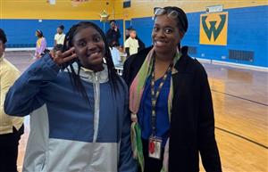  Adult and Student posing for picture